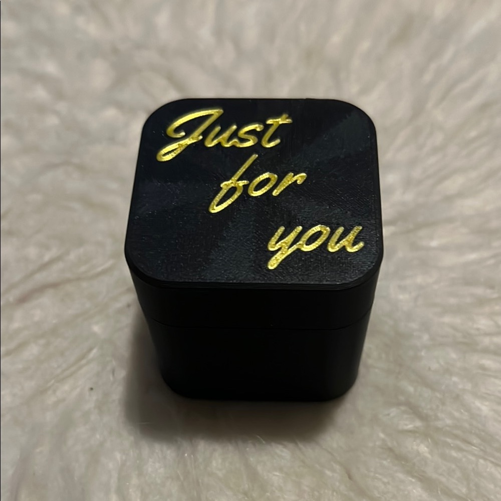 Black Box with Gold Text